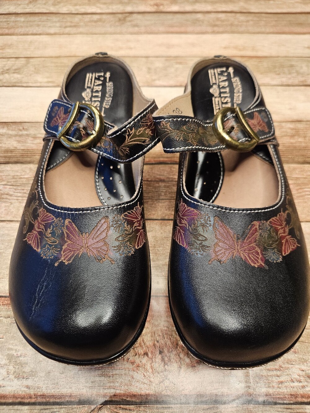 L'Artiste Tiny Dance clogs, featuring a charming hand-painted pink butterfly